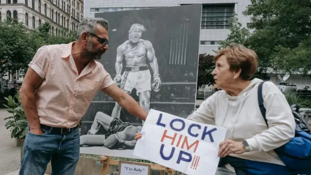 People protest against former US President Donald Trump outside the courthouse