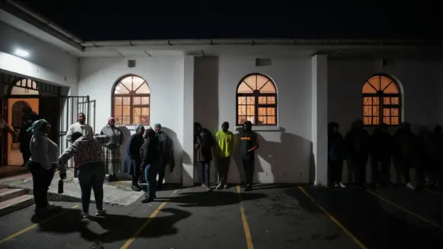 People queue to vote in the South African elections in Masiphumelele, South Africa, May 29,