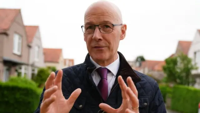 SNP Leader John Swinney doing media interviews as he goes canvassing with SNP activists in Grierson Square, Edinburgh, while on the General Election campaign trail. Picture date: Tuesday May 28, 2024