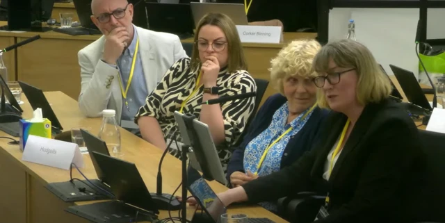 Jo Hamilton, in the middle, sits at the inquiry beside her lawyer Angela Patrick