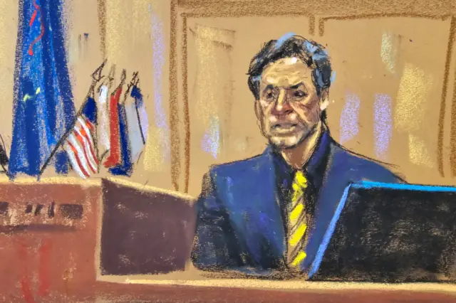 A courtroom sketch of a man in a blue suit and yellow tie speaking