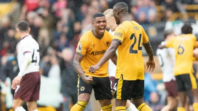 Wolves players celebrate beating Manchester City