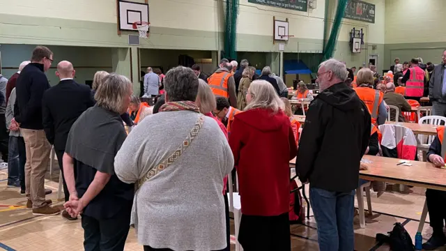 Staff counting votes for the West Oxfordshire local election in a sports hall