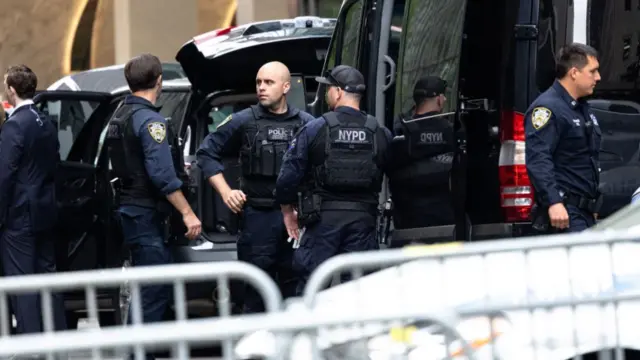 NYPD officers milling around