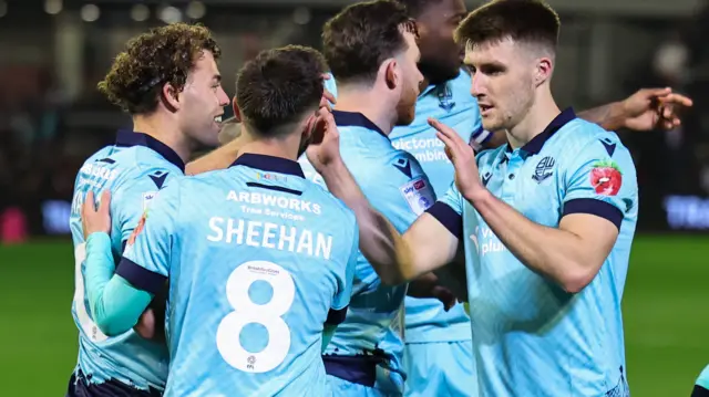 Bolton players celebrate scoring