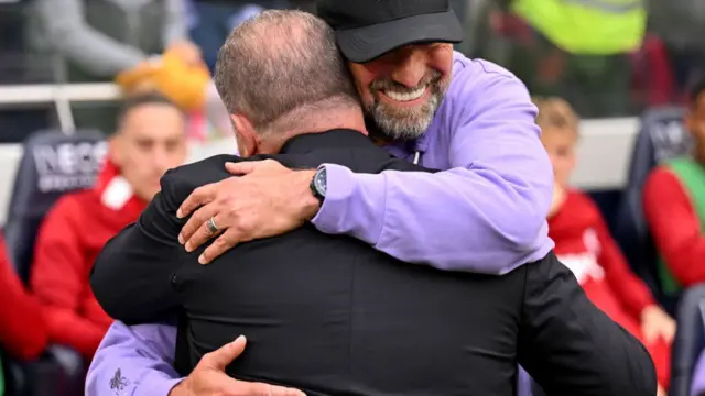 Tottenham's Ange Postecoglou hugs Jurgen Klopp at Anfield