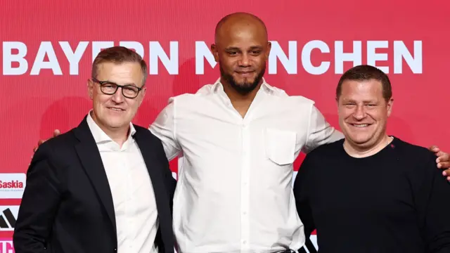 Bayern Munich's chief executive Jan-Christian Dreesen and board member for sport Max Eberl with Vincent Kompany at his first news conference as Bayern coach