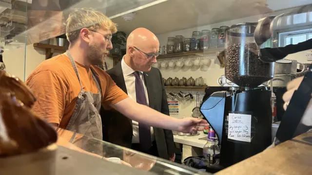 SNP leader John Swinney watching how to make coffee