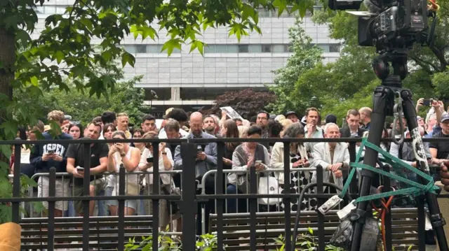 People outside a Manhattan court house