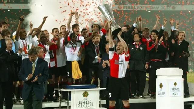 Feyenoord captain Paul Bosvelt lifts the Uefa Cup trophy in 2002