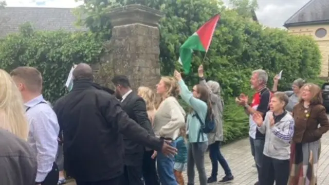 Protesters with Palestinian flag