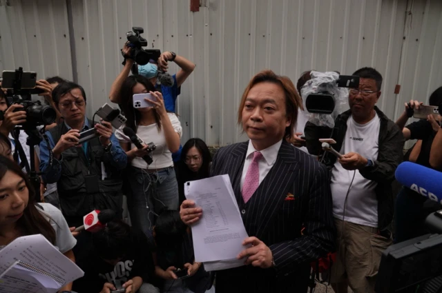 Lawrence Lau seen after his acquittal outside the West Kowloon Magistrates Court