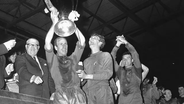 Bobby Charlton lifts the European Cup trophy after Manchester United beat Benfica in the 1968 final