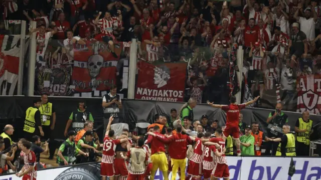 Olympiakos players and fans celebrate Ayoub El Kaabi's goal in the Europa Conference League final