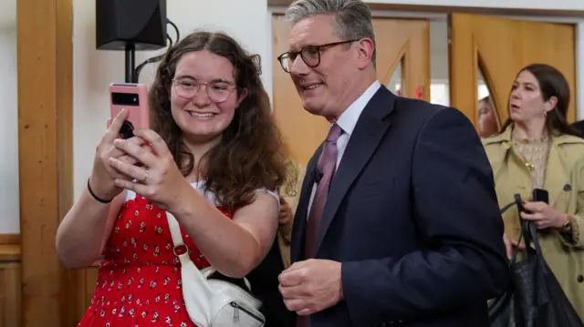 Labour leader Keir Starmer takes a selfie with a supporter in Wales