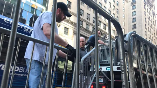 Barriers are put up on the sidewalks outside Trump Tower