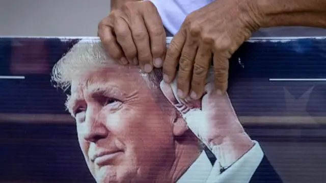 A Trump supporter holds a sign in Florida yesterday