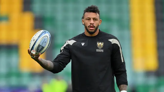 Courtney Lawes holds a ball during a pre-game warm-up this season