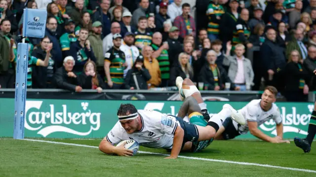 Jamie George dives over the try line