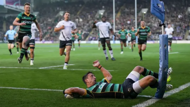 Alex Mitchell on the floor after being tackled and denied a try