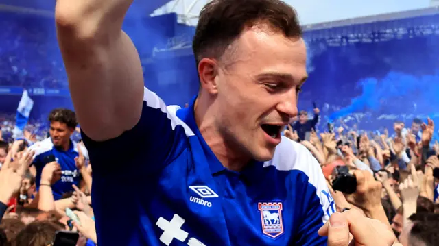 Ipswich players celebrate with fans