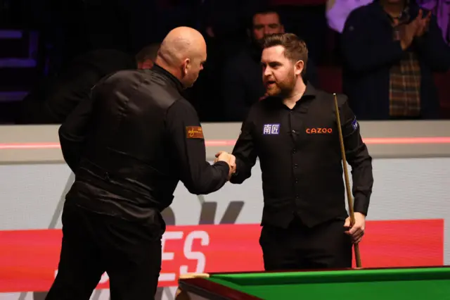 Stuart Bingham congratulates Jak Jones