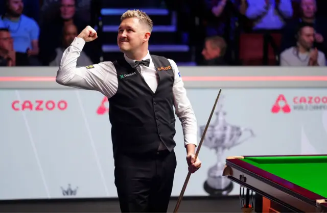 Kyren Wilson fist-pumps the air after beating David Gilbert in the World Championship semi-final