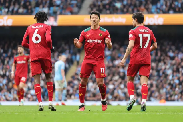 Hwang Hee-Chan of Wolverhampton Wanderers celebrates scoring his team's first goal during the Premier League match between Manchester City and Wolverhampton Wanderers