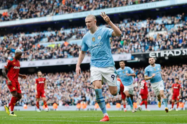 Erling Haaland of Manchester City celebrates after scoring a goal to make it 3-0 during the Premier League match between Manchester City and Wolverhampton Wanderers