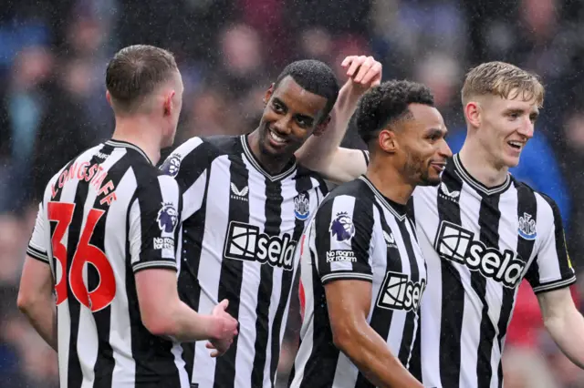 Alexander Isak of Newcastle United celebrates scoring his team's fourth goal with teammates Sean Longstaff, Jacob Murphy and Anthony Gordon during the Premier League match between Burnley FC and Newcastle United