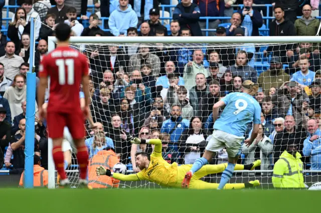 Erling Haaland of Manchester City scores his team's third goal from the penalty spot during the Premier League match between Manchester City and Wolverhampton Wanderers