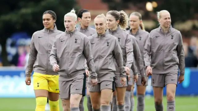 Beth England leads out Tottenham's players