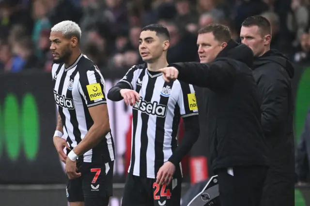 Joelinton and Miguel Almiron of Newcastle United are substituted on during the Premier League match between Burnley FC and Newcastle United