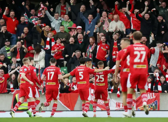 Ronan Hale celebrates his goal with Cliftonville fans at Windsor Park