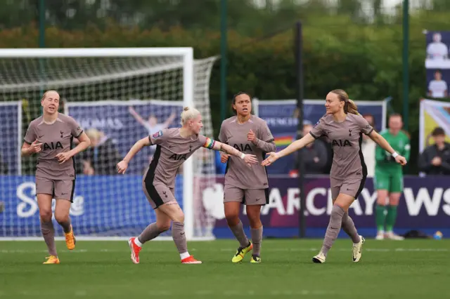 Bethany England celebrates