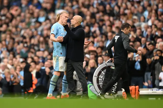 Pep Guardiola, Manager of Manchester City, and his player, Erling Haaland clash upon his substitution during the Premier League match between Manchester City and Wolverhampton Wanderers