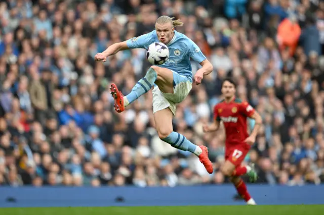 Erling Haaland of Manchester City controls the ball in the air during the Premier League match between Manchester City and Wolverhampton Wanderers