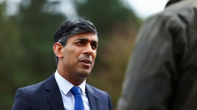 Prime Minister Rishi Sunak speaks as he takes part in broadcasting a clip during his visit to the Helles Barracks at the Catterick Garrison