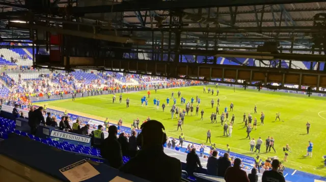 Blues players lap pitch