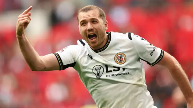 Michael Cheek celebrates