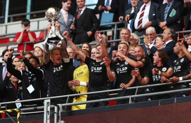 Bromley skipper Byron Webster lifts the 2022 FA Trophy