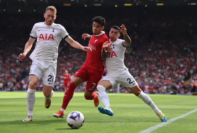 Spurs players battle Diaz for the ball