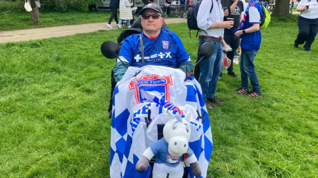 Trevor Willard in an Ipswich shirt and decorated mobility scooter