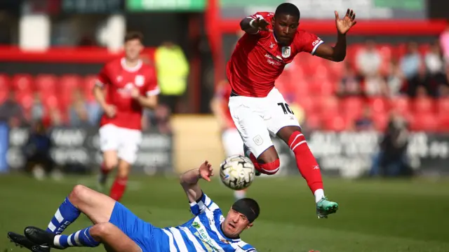 Shilow Tracey, of Crewe Alexandra, skips past Doncaster's Richard Wood