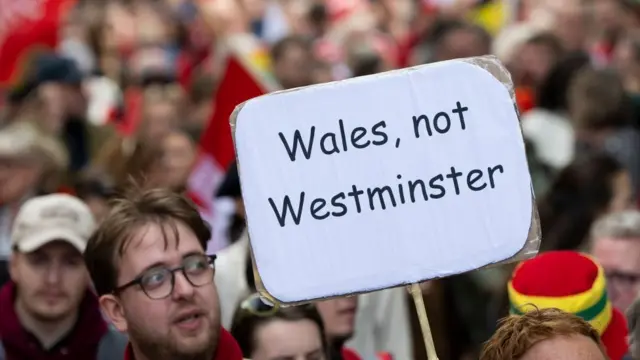 A campaigner holding up a sign