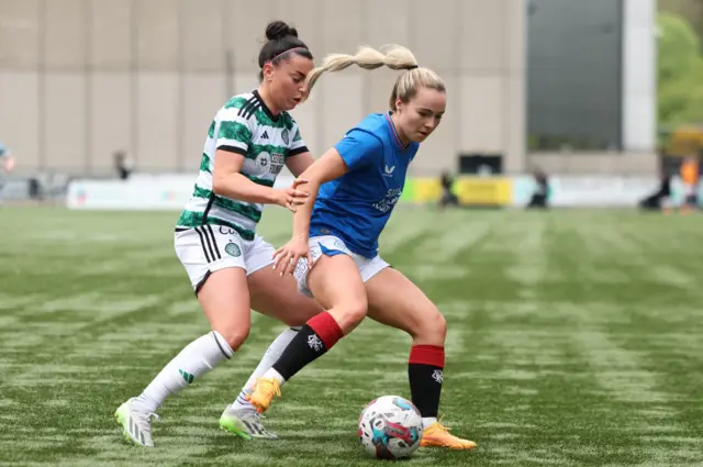 Celtic's Amy Gallacher and Rangers' Liv McLoughlin battle for the ball