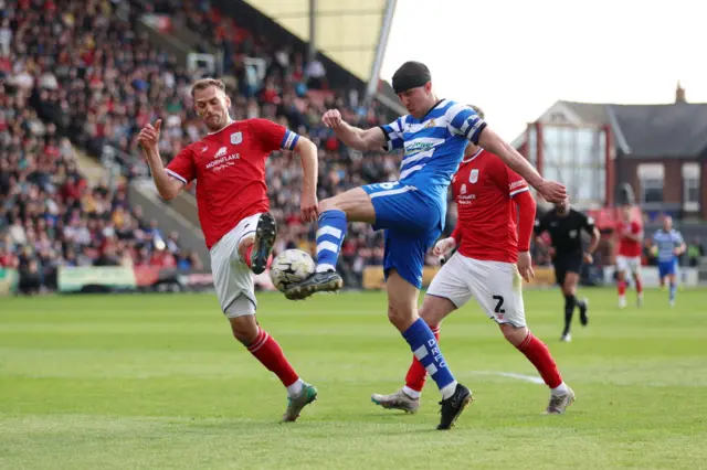 Richard Wood of Doncaster Rovers has a shot blocked by Mickey Demetriou of Crewe Alexandra