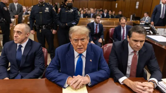 Trump at table with lawyers