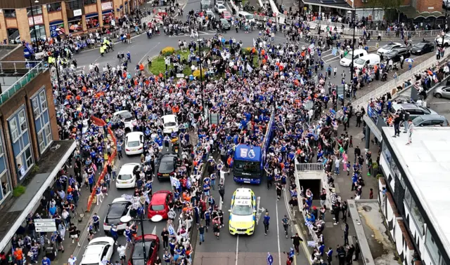 An aerial photograph of Ipswich Town promotion celebrations as an open-top bus passes through the town centre