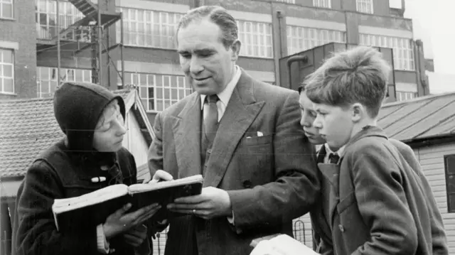 Sir Alf Ramsey signing autographs at Portman Road